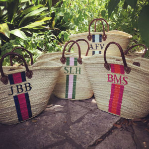 Monogrammed Straw Tote s from Lively Design Studio are hand-painted by artisans in Austin, Texas, and customized by color combo and monogram choice. 