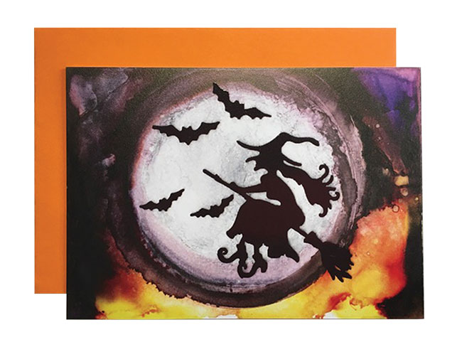 MoesArt Studios Halloween Card featuring bats and a witch on a broom