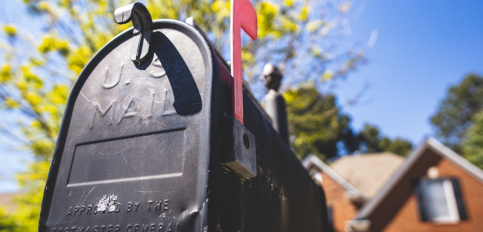 Image of a residential mailbox with flag up